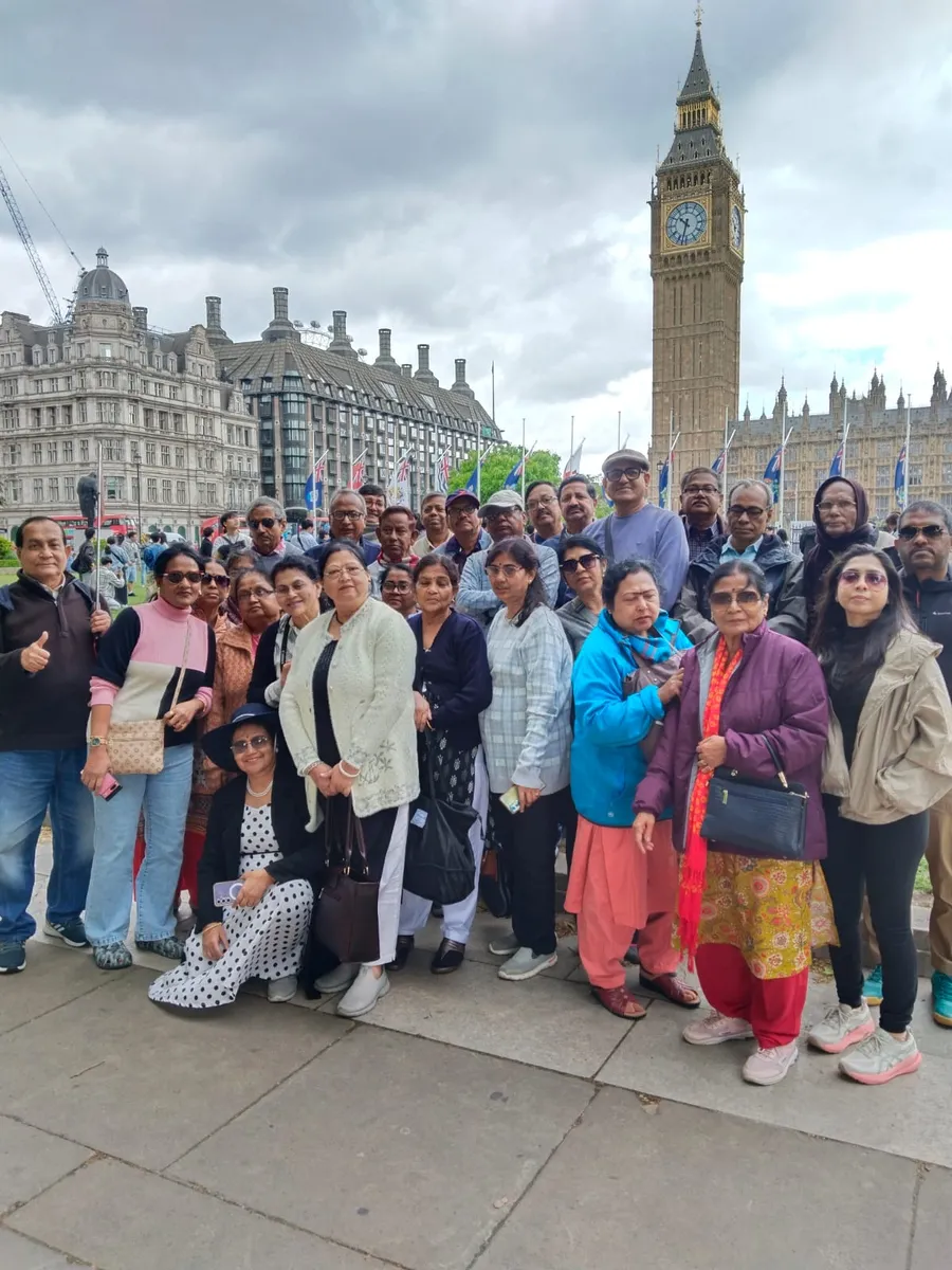 An HCG group of around fifty travellers outside the Houses of Parliament and Big Ben in London