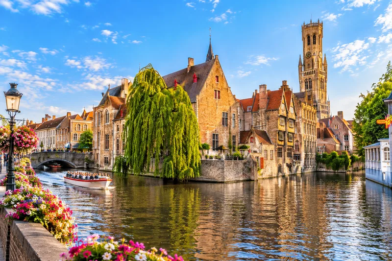 A canal and the belfry in the old centre of Bruges