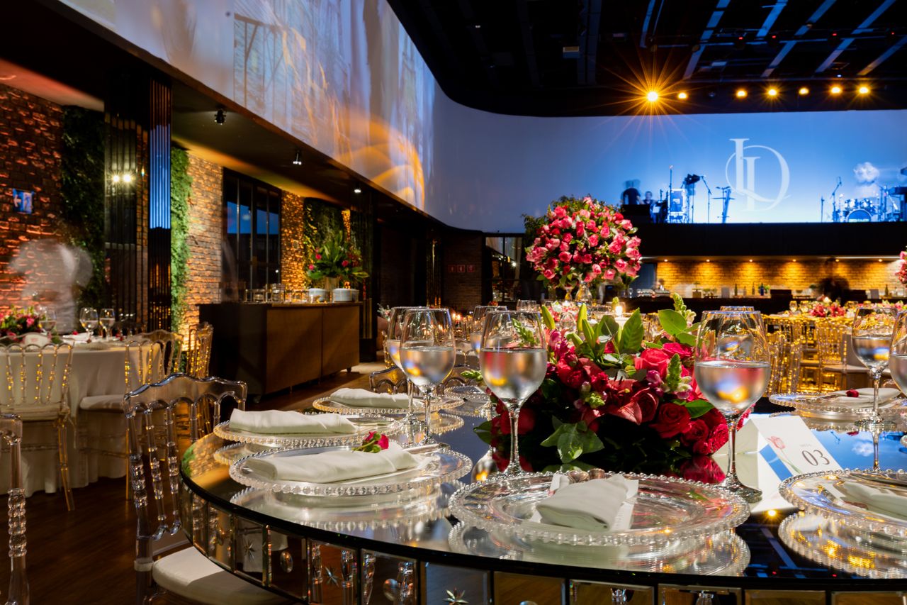 Gala dinner set with staging and floral centrepieces