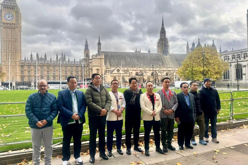 An HCG group outside the Houses of Parliament and Big Ben in London